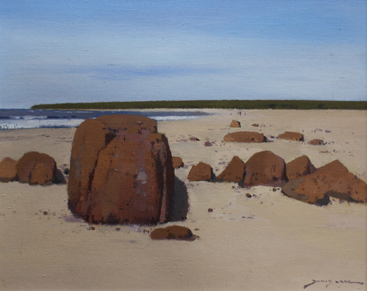 Rocks and sand and a view south along Dolphin Beach, Moruya.