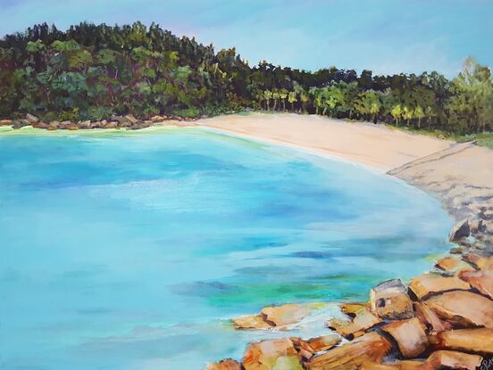 Turquoise water sandy beach rocks and trees