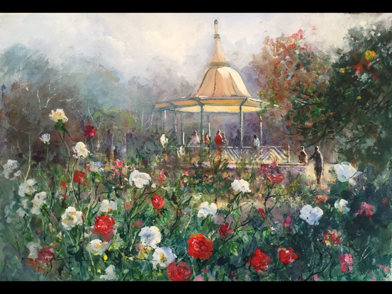 Park pavilion seen through a riot of colour from the flowers . Soft background to enhance the perspective in this work