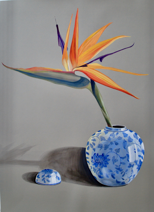 A single bird of paradise in a Chinese bowl.