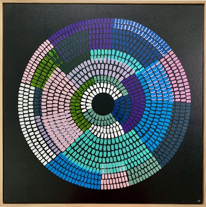 Circular shape made up of bright vibrant strokes, blues pinks purples on a black background. 