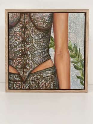 A cropped painting of a woman standing, showing her waist, with an olive branch in the back ground.