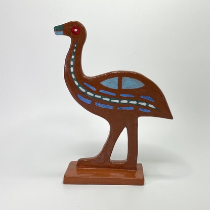 Handsome emu hand built from red clay, decorated with various glazes.