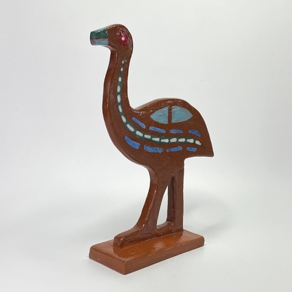 Handsome emu hand built from red clay, decorated with various glazes.