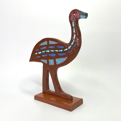 Handsome emu hand built from red clay, decorated with various glazes.