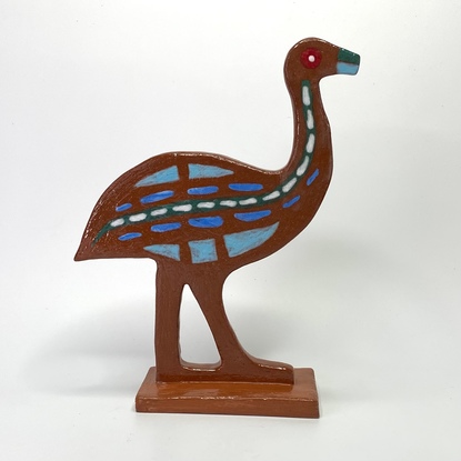 Handsome emu hand built from red clay, decorated with various glazes.