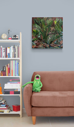 Two green tree frogs perched on wood and rocks at the foot of a fig tree.