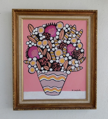 A vase of abstract flower shapes using pinks and tones of pink, yellow and white. The vase has vintage inspired wavy patterns in pink, yellow and white. 