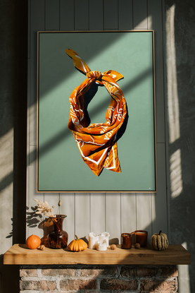 Yellow Bandana looped and tied on a sage green background