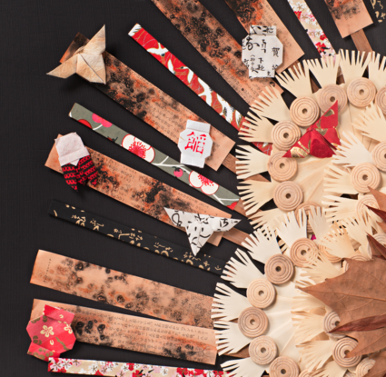 Japanese women with tribal inspired head dress incorporating origami and japanese papers