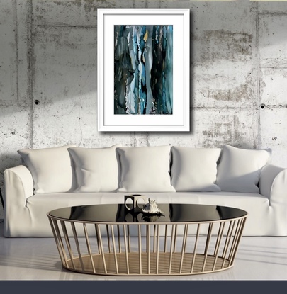 Contemporary aerial painting of Blue Mountains rivers and waterfalls.  Painted in alcohol inks. A flowing artwork in colours of soft blues and greys with touches of pink, white and gold depicting splashing water.  This painting is framed in white timber, acrylic glass and ready to hang.