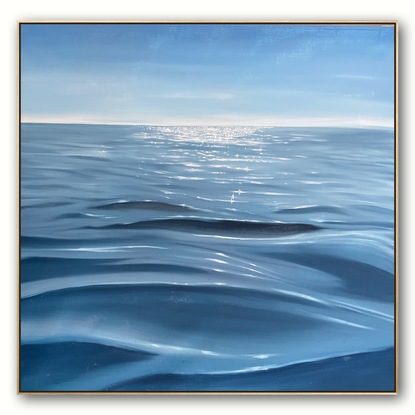 Ocean surface under a blue sky