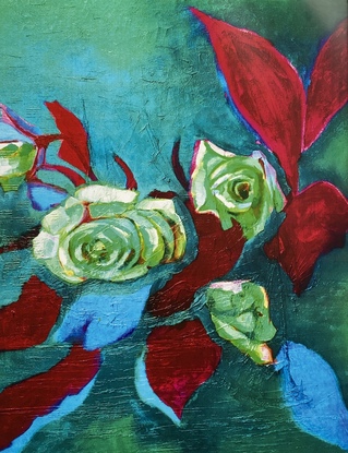 Brightly coloured green and blue roses with red leaves