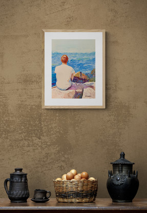 Man views the ocean in the sunshine.