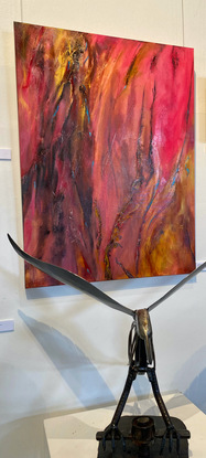 Large textured acrylic aerial painting in shades of maroon magenta and pinks with soft gold highlights depicting the Australian Outback at sunset.