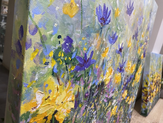 A playful garden of soft purple and yellow buds and flowers growing I. A tangle of leaves and colour. I love the energy of this painting and it seems like you are just waiting for the next butterfly or bee to come a long. It would be the perfect garden for running children 