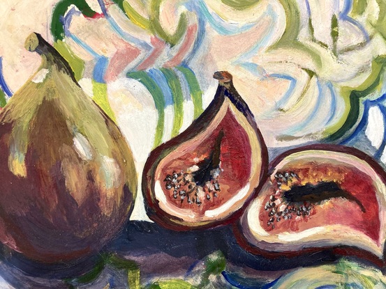 Two ripe delicious figs on a European patterned cloth.