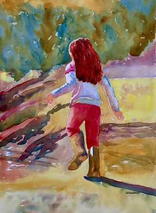 Girl in wellingtons off to splash in puddles.