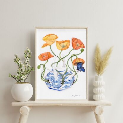 A watercolor painting of a broken Chinese Qing Dynasty teapot with vibrant orange poppies growing out of its cracks. The teapot’s delicate blue and white porcelain contrasts with the bold orange flowers, which symbolize growth and renewal. The muted background highlights the teapot and poppies, creating a sense of beauty emerging from brokenness.