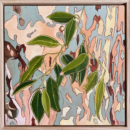 Green gum leaves superimposed over a patterned background 