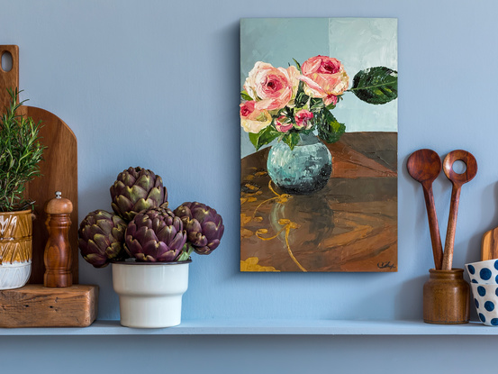 pink roses in little ceramic vase