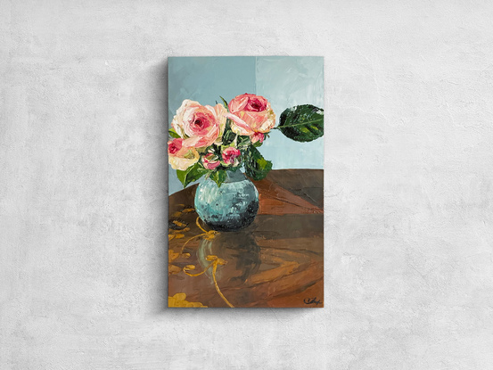 pink roses in little ceramic vase