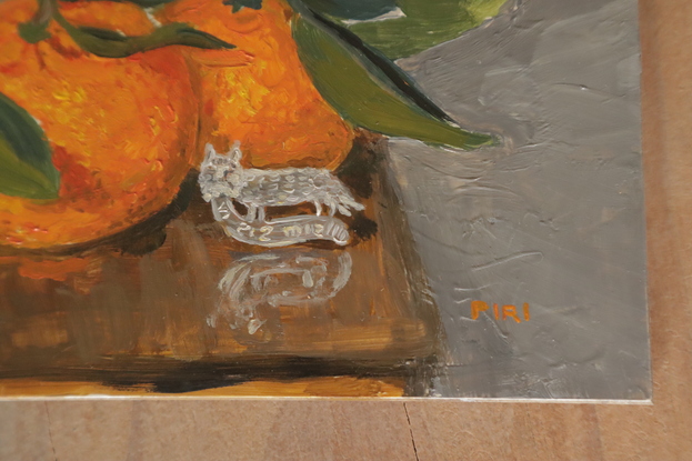 Impressionistic painting of a grey bunny on a Fry's Homeopathic Cocoa wooden box. In front of them sits 3 beautiful mandarin oranges, with stems and leaves, and a silver medieval replica pin  which is of a cat with a mouse in its mouth, it reads "vi sis mis" - I have the mouse.