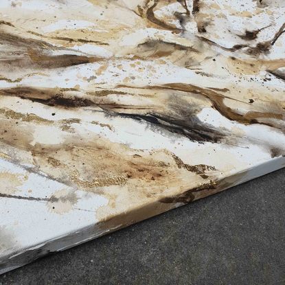 A large painting of marble with metallic gold, brown, earth tones and white