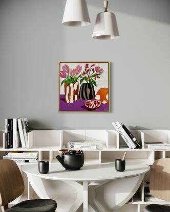 Flowers in the  candy Glass vase and pomegranate on table 