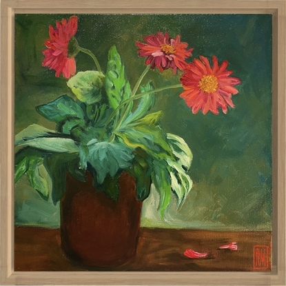 A terracotta planter pot is in the middle of the canvas filled with a Gerbera plant.  The lush green leaves spill over the edge of the pot while three arching stems hold large, red flower heads.  The background is painted in shades of brown and green.