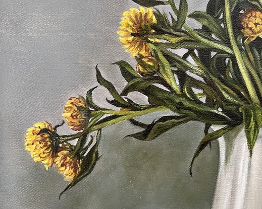 A square canvas frames a large bunch of yellow straw flowers nestled in a white pottery jug.  There are many intertwining leaves and stems.  Light comes from the right hand side casting shadows on the wall and mantle where the jug sits and turning the light grey wall bluish green.