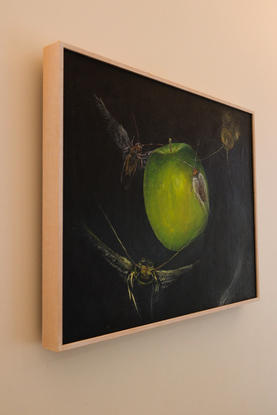 This composition shows surrealistic insects flying around a green apple with a dramatic background.