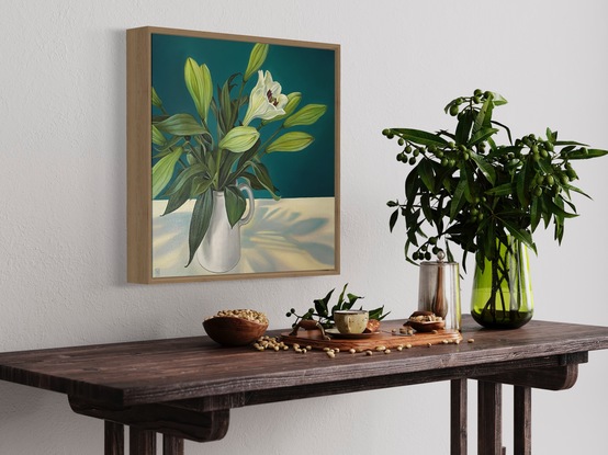 A square canvas frames a large bunch of white lilies which sit in a white jug on a white table.  Lit from above, bluish shadows fan out on the table below.  The background is painted in a strong peacock blue.