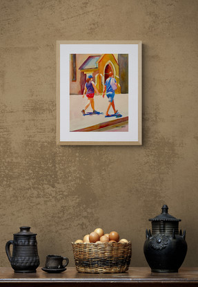 Couple walks in front of a chapel.