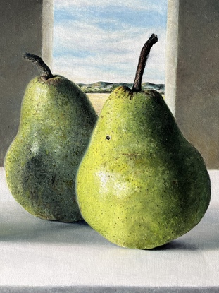 four green pears with dark background