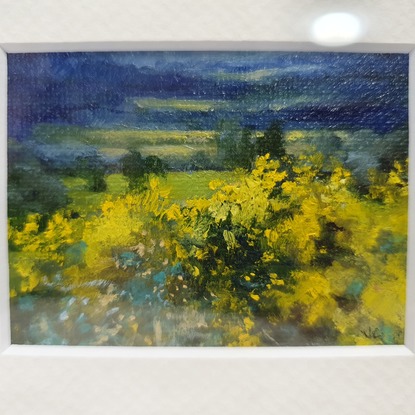 Miniature landscape of dark blue fields and hills with yellow wattle bushes, by Australian artist Victoria Collins