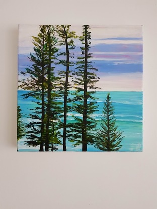 Norfolk Island pines turquoise waves mauve sky