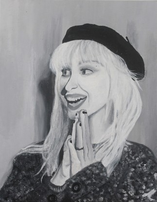 A black and white portrait of Hayley Williams (Paramore).