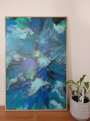 This is a 90cm x 60cm acrylic pour painting using blow out technique.  Painting has had clear acrylic spray over top to protect painting.  Art work is framed with wood backing and is ready to hang.