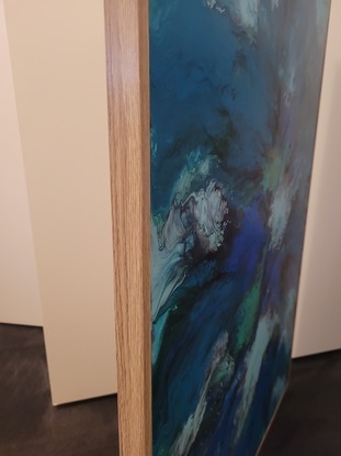 This is a 90cm x 60cm acrylic pour painting using blow out technique.  Painting has had clear acrylic spray over top to protect painting.  Art work is framed with wood backing and is ready to hang.