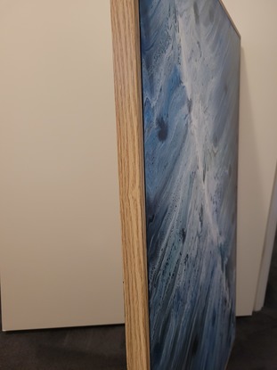 This is a 90cm x 60cm acrylic pour painting using swipe technique.  Painting has had clear acrylic spray over top to protect painting.  Art work is framed with wood backing and is ready to hang.