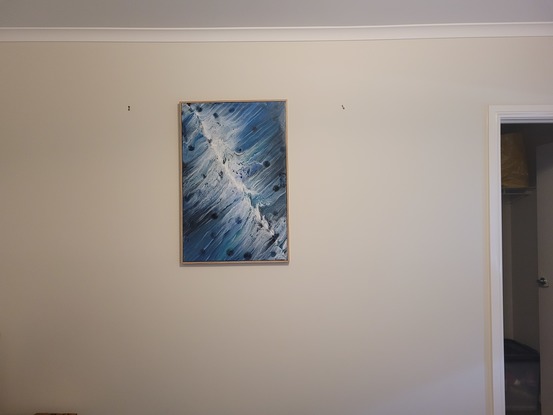 This is a 90cm x 60cm acrylic pour painting using swipe technique.  Painting has had clear acrylic spray over top to protect painting.  Art work is framed with wood backing and is ready to hang.