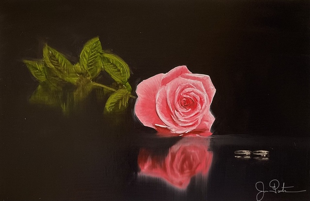 Rose and two ring on glass table 