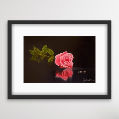 Rose and two ring on glass table 