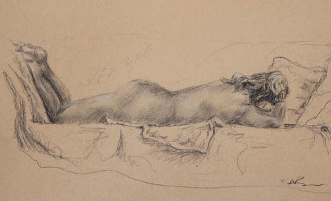 A female nude model lying down on chest in a sleeping position in black charcoal on brown textured paper.