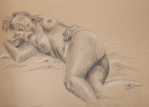 Black charcoal life drawing of a female model reclining on back away from the viewer on brown textured paper.