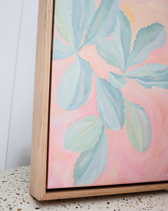 Turquoise banksia leaves on colourful pink background of organic brushstrokes