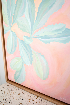 Turquoise banksia leaves on colourful pink background of organic brushstrokes