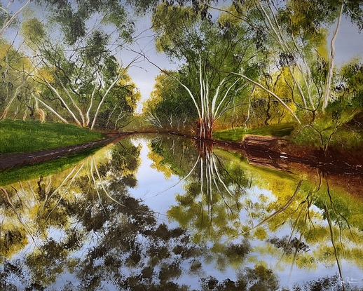 River reflecting surrounding gumtrees 