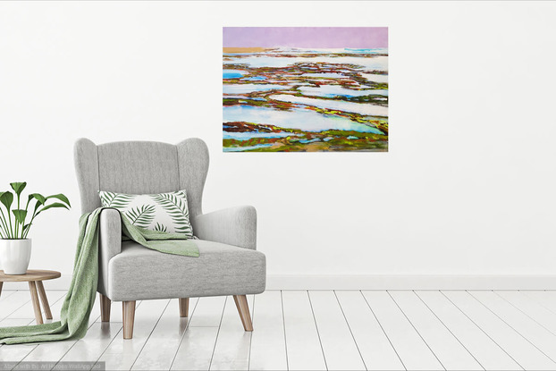 glistening water in rock pools on ocean rock shelf with waves sand and mauve sky
